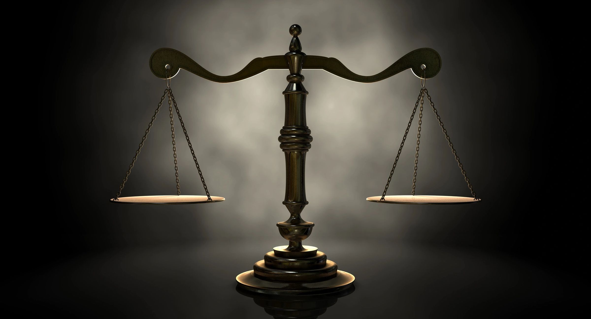 Milford wrongful death lawyer of new hampshire features photo of the scales of justice with a black and white background representing wrongful death claims and milford nh free legal consultation for them