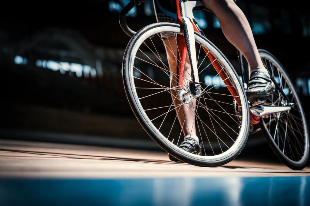 Milford bike accident lawyer features photo of a new hampshire cyclist waiting for a safe break in traffic to continue their ride